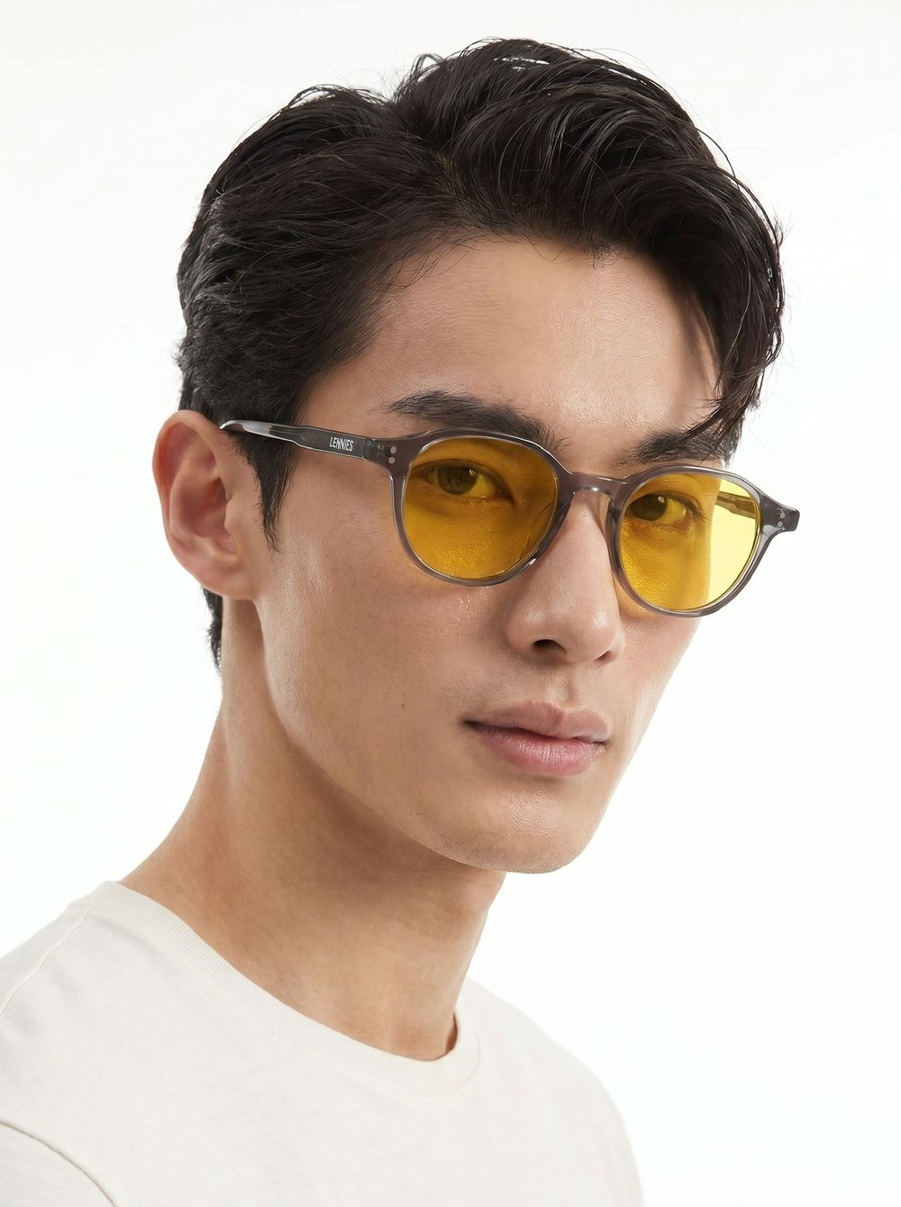 Man wearing the round grey frame with Unwind Lens
