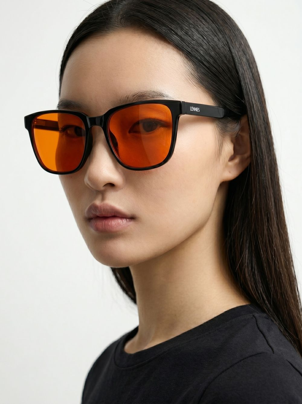 Woman wearing the square black frame with Blackout Lens